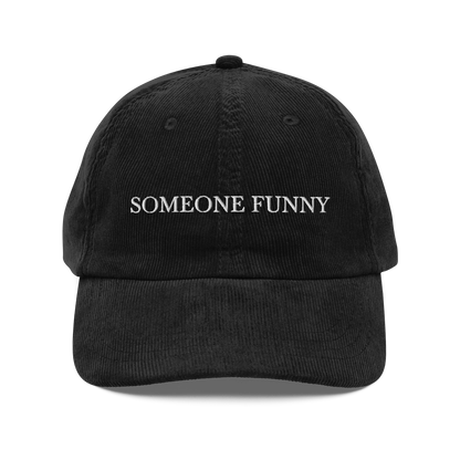 Black corduroy hat with 'SOMEONE FUNNY' text on a white background